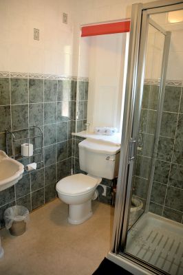 The double bedroom has en-suite facilities comprising a shower, WC and wash hand basin.